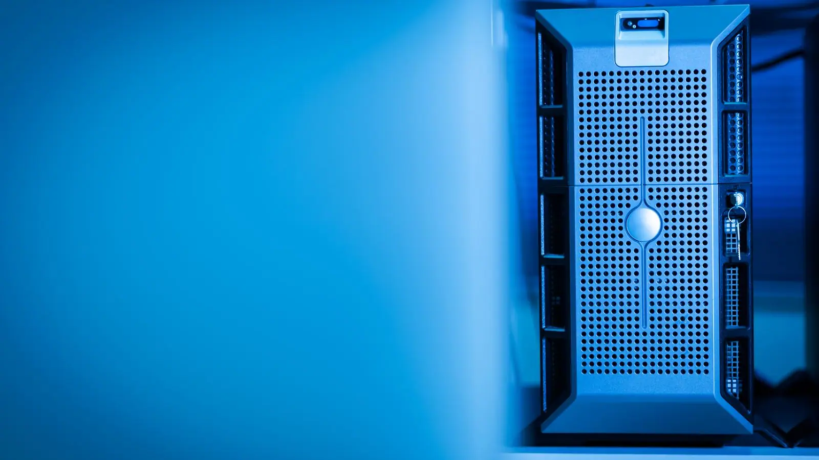Server rack lit in blue in a data centre